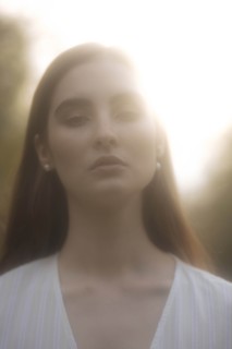Portrait of young woman in sunlight