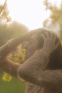 Young woman with her hands on her head