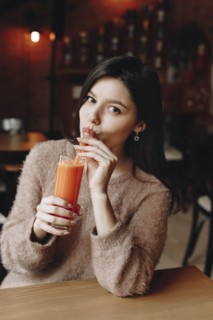 Young woman drinking juice