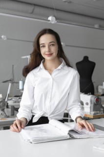 Fashion designer working at desk in studio