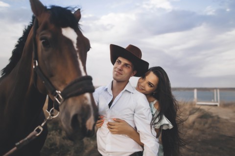 Young couple by horse