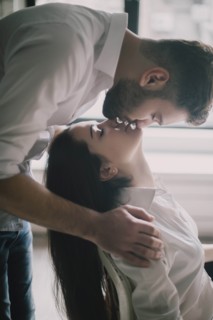 Young couple face to face with their eyes closed