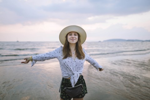 Young woman in sun hat on beach in Krabi, Thailand