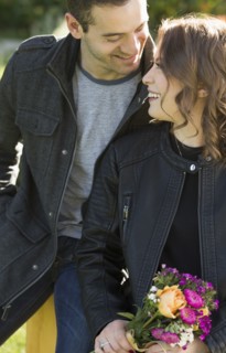 Young couple with bouquet of flowers