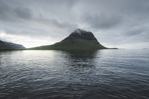 Kirkjufell under overcast sky in Iceland