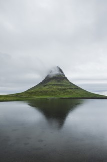 Kirkjufell under overcast sky in Iceland