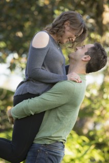 Man lifting young woman