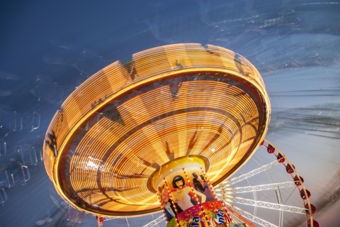 Long exposure of illuminated chain swing ride