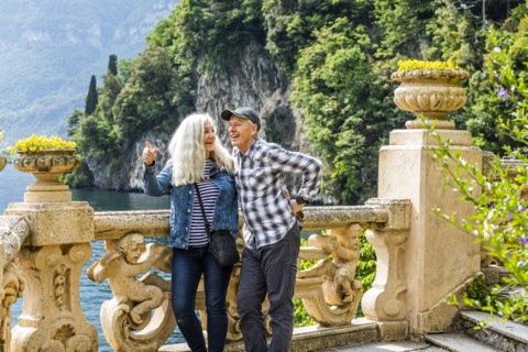Smiling couple at Villa del Balbianello by Lake Como, Italy