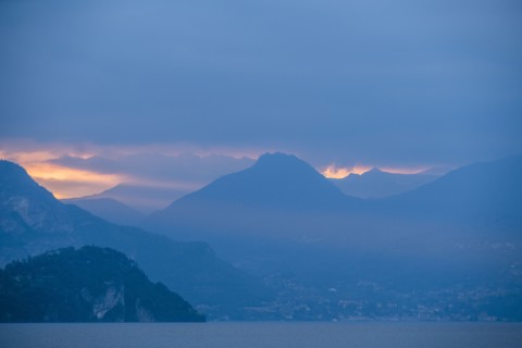 Sunset sky over mountains by Lake Como, Italy