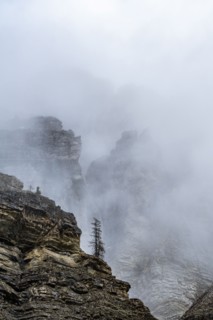Cliffs in fog in Dolomites, Italy