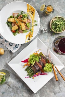 Dinners of roast beef and meat salad with red wine