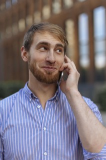 Bearded man on phone call