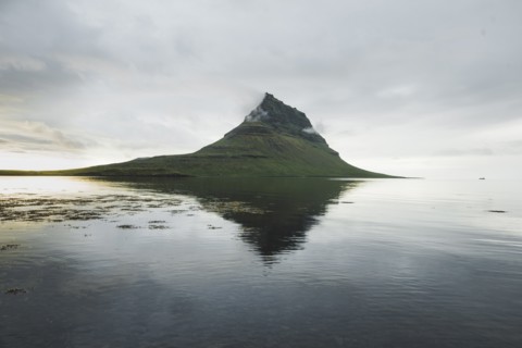Kirkjufell under overcast sky in Iceland