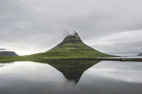 Kirkjufell under overcast sky in Iceland