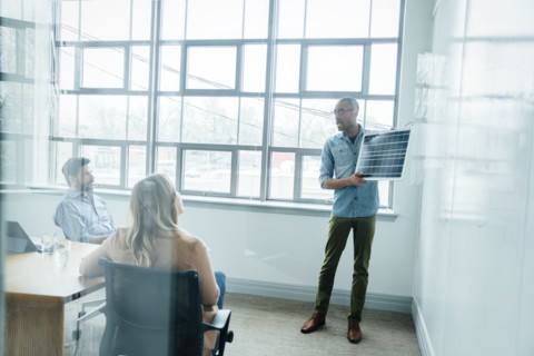 Man using diagram during board room presentation