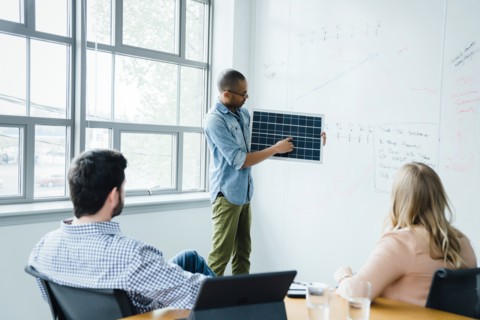 Man using diagram during board room presentation