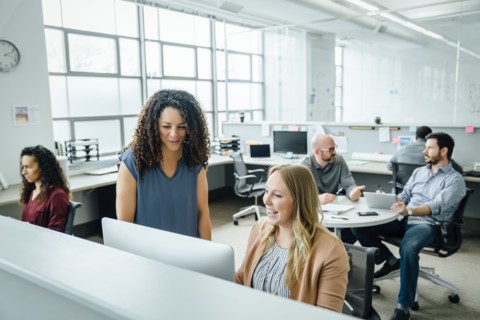 Women using computer in office