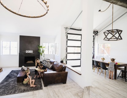 Family in open plan living and dining area