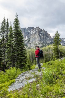Senior man hiking by mountain in Stanley