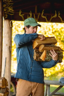 Young man holding firewood