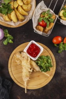 Deep fried food with tomato sauce