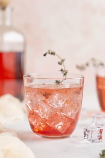 Pink cocktail with ice cubes