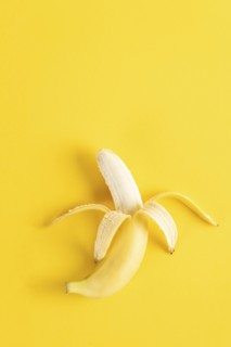 Banana on yellow surface
