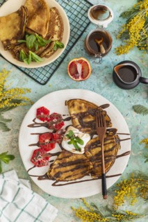 Crepes with chocolate sauce and blood oranges