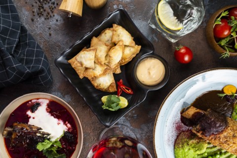 Fried fish appetizer by dinner of meat and mushy peas