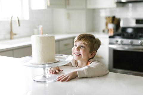 Boy smiling at birthday cake