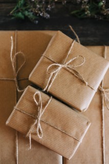 Presents wrapped in brown paper and string