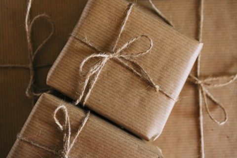 Presents wrapped in brown paper and string