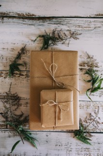 Presents wrapped in brown paper and string with flowers