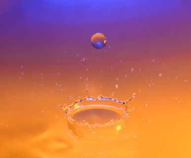 Orange and purple splashing water