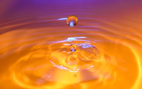 Orange and purple splashing water