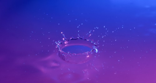 Purple and blue splashing water