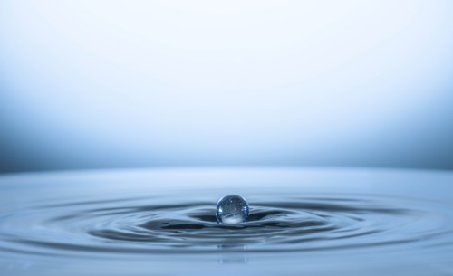Water drop creating circular ripples