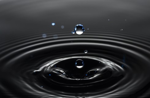 Water drop creating circular ripples