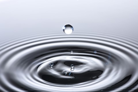 Water drop creating circular ripples