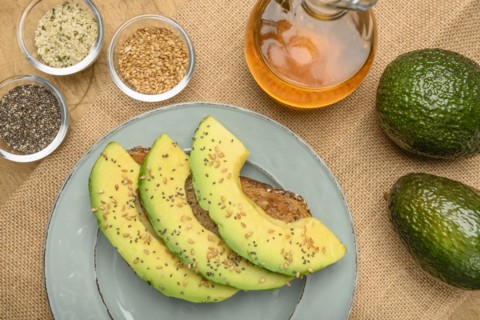 Sliced avocado on toast with seeds
