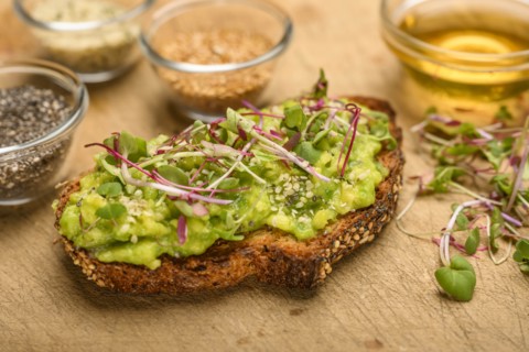 Avocado and bean sprouts on toast