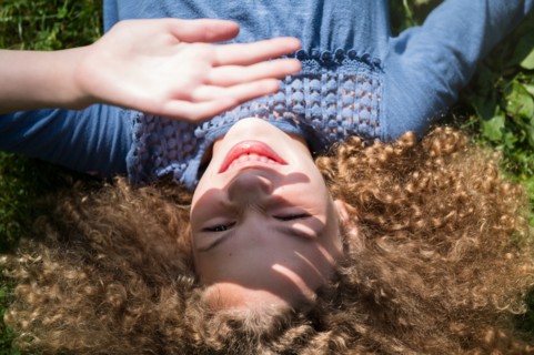 Girl shielding her eyes