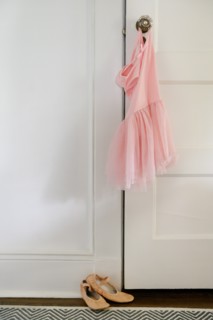 Pink ballet tutu hanging on doorknob