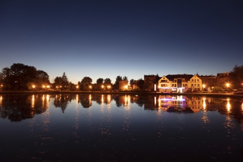 Lake and street lights at sunset in Mragowo, Warmian-Masurian, Poland