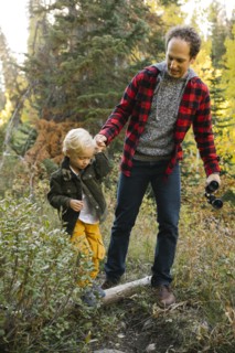 Father and son in forest