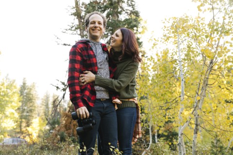 Couple smiling in forest