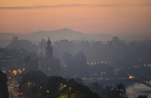 Cityscape with Torre del Oro at sunset in Seville, Andalusia, Spain