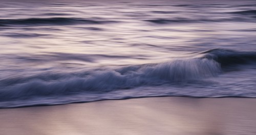 Blurred image of waves on beach