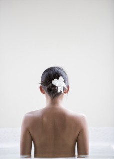 Rear view of woman in spa